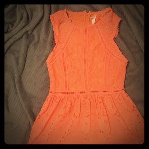 This is a salmon pink dress